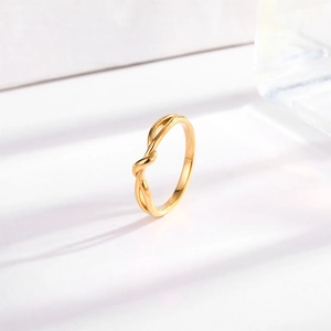 Elegant gold knot ring in minimalist style crafted from polished titanium steel
