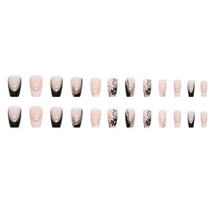 French ballerina press-on nails set with black and pink floral designs and glitter accents