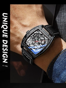 Close-up of tonneau-shaped skeleton watch with black leather strap on wrist