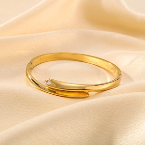 Minimalist 18K gold-plated stainless steel bracelet with zircon stone on champagne silk