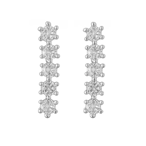 Detail of silver drop earrings with five claw-set round clear stones in a row