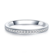 Macro shot of silver metal eternity band with pavé set cubic zirconia stones