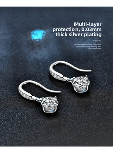 Detail view of 925 sterling silver earrings with 0.03mm plating and sparkling moissanite