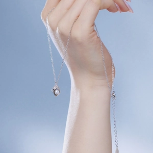 Detail of silver S925 necklace with pearl shell pendant and adjustable lobster clasp