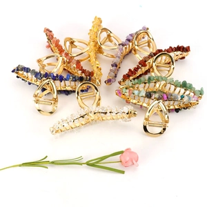 Golden alloy hair clips with colorful natural crystal stone wrapping on white background