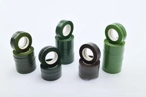 Close-up of assorted floral tape rolls in green and brown for DIY flower arrangements