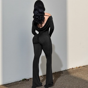 Slim fit black backless jumpsuit with long sleeves, push up ruching and flared leg design