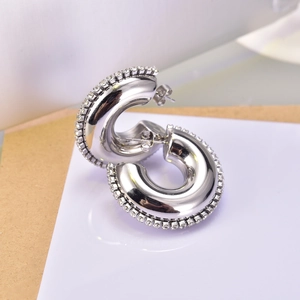 Silver C-shaped stud earrings with zircon rim and polished steel finish