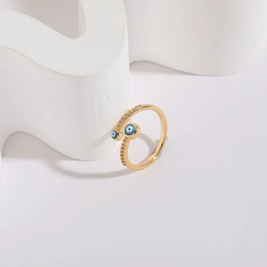Detail of 14K gold plated Evil Eye ring with blue enamel and sparkling crystal accents