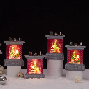 Set of four lighted Christmas fireplace snow globes with Santa and tree scenes