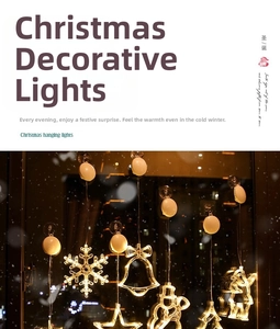 Detail of warm white LED suction cup lights in snowflake and reindeer shapes on glass