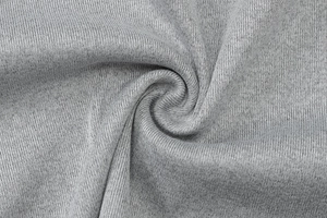 Macro della trama del tessuto a maglia grigio che mostra la maglia morbida e i dettagli