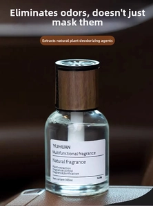 Detail of 160ml car air freshener with wood grain lid on dark leather surface