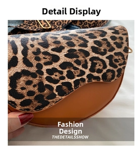 Detail of leopard print flap and brown smooth leather on the saddle bag with gold buckle