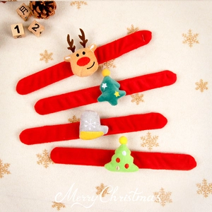 Set of 4 Christmas snap bracelets with reindeer and tree motifs on festive red fabric