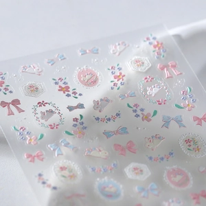 3D embossed nail stickers featuring pastel bows and rabbits for creative manicure art