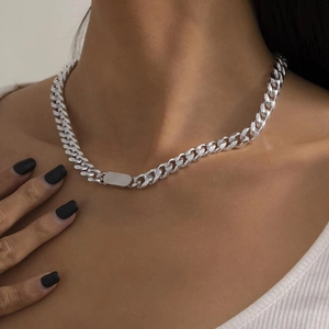 Close-up of hip hop silver cuban link chain necklace with smooth rectangle bar pendant
