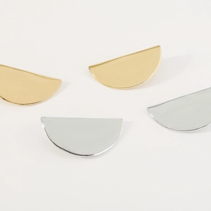 Minimalist semi-circular geometric earrings in gold and silver finish with mirror design