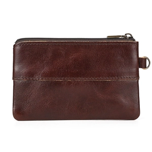 Detail of dark brown crazy horse leather coin purse with vintage texture and D-ring