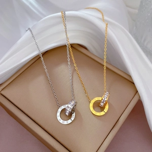Minimalist double interlocking ring necklace in gold and silver with Roman numerals