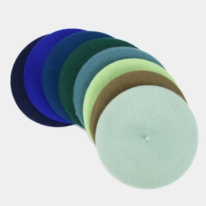 Detailed collection of wool berets in various elegant colors like teal, brown and green
