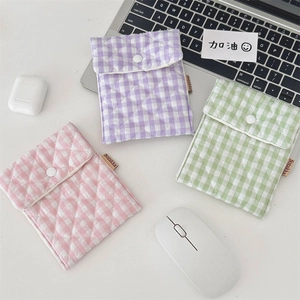 Quilted cotton storage pouches in lavender, mint green, and pink for sanitary pads