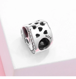 Detailed close-up of S925 sterling silver heart charm with cubic zirconia and enamel