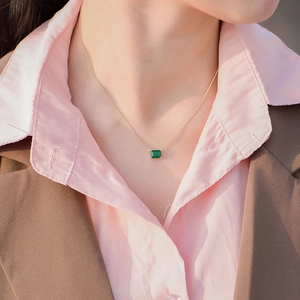 Minimalist S925 sterling silver necklace with emerald cut green gemstone on a gold chain