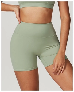 Detailed view of high-waist light green yoga shorts with tight fit and ribbed texture