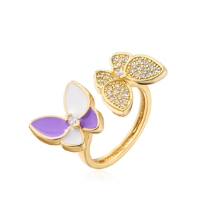 Macro detail of 18K gold-plated butterfly ring with purple enamel and micro zircon