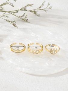 Detailed view of three-piece gold ring set featuring micro-zircon crown and inner diameters