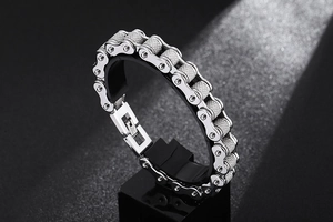 Close-up of vintage silver bicycle chain bracelet in titanium steel with a secure folding clasp