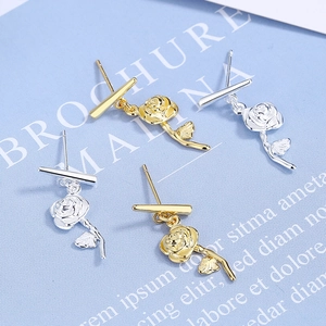 Elegant rose stud earrings in gold and silver finishes with realistic petal textures