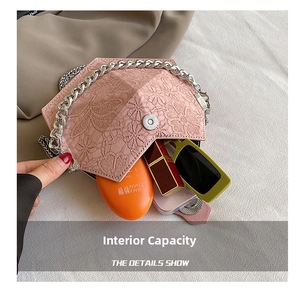 Detail showing internal capacity of pink lace quilted envelope bag with silver chain