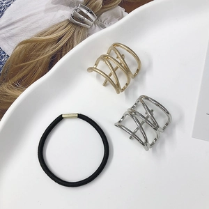 Set of minimalist gold and silver hollow metal hair cuffs with black elastic hair ties