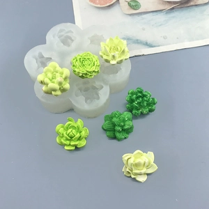 3D succulent silicone mold set with finished flower-shaped candles on grey background