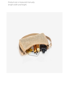 Internal storage view of beige woven hobo bag with phone, lipstick and sunglasses