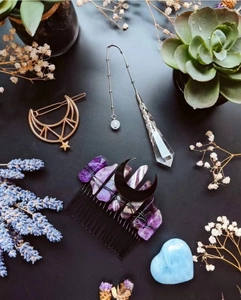 Detail of gothic amethyst hair comb with black crescent moon and crystal pendulum pendant