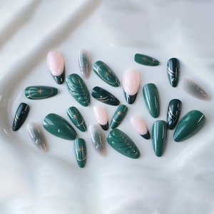 3D cat eye green French long almond press-on nails with marble patterns and gold accents