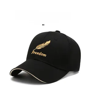 Detail of the black mesh baseball cap featuring golden Freedom feather embroidery
