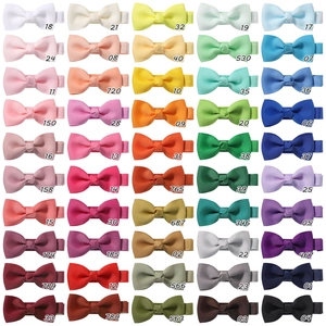 Detailed grid showing 50 colorful ribbon bow hair clips with specific color numbering