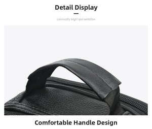 Close-up of reinforced leather handles and zipper detail on black business bag