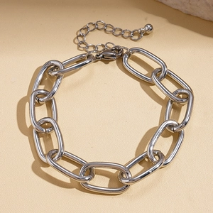 Detailed close-up of a silver thick chain bracelet with an adjustable extension and metal ball