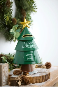 Detailed view of green metal Christmas tree mailbox with Santa letters engraving and star