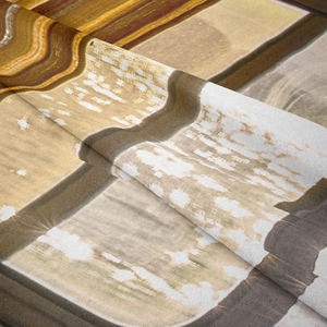 Close-up of abstract marble texture on Bohemian tapestry with soft fabric folds