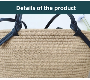 Macro detail of natural straw texture and black leather knot handle on woven tote bag