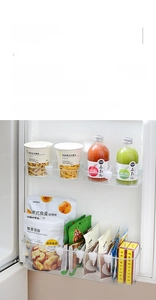Close-up of adjustable transparent refrigerator door organizers with clip-on design