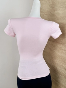 Back view of a slim-fit pink short-sleeve T-shirt with U-neck on a display mannequin