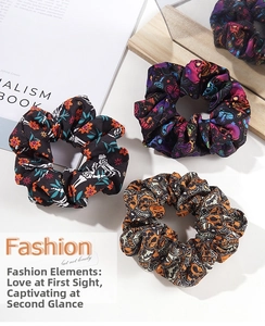 Detailed view of Halloween scrunchies with skull, pumpkin and witch hat patterns