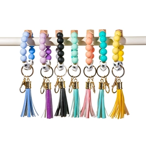 Detail of colorful silicone bead wristlet keychains with MAMA letter beads and tassels